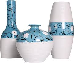 blue and white ceramic three-piece decorative vase set.